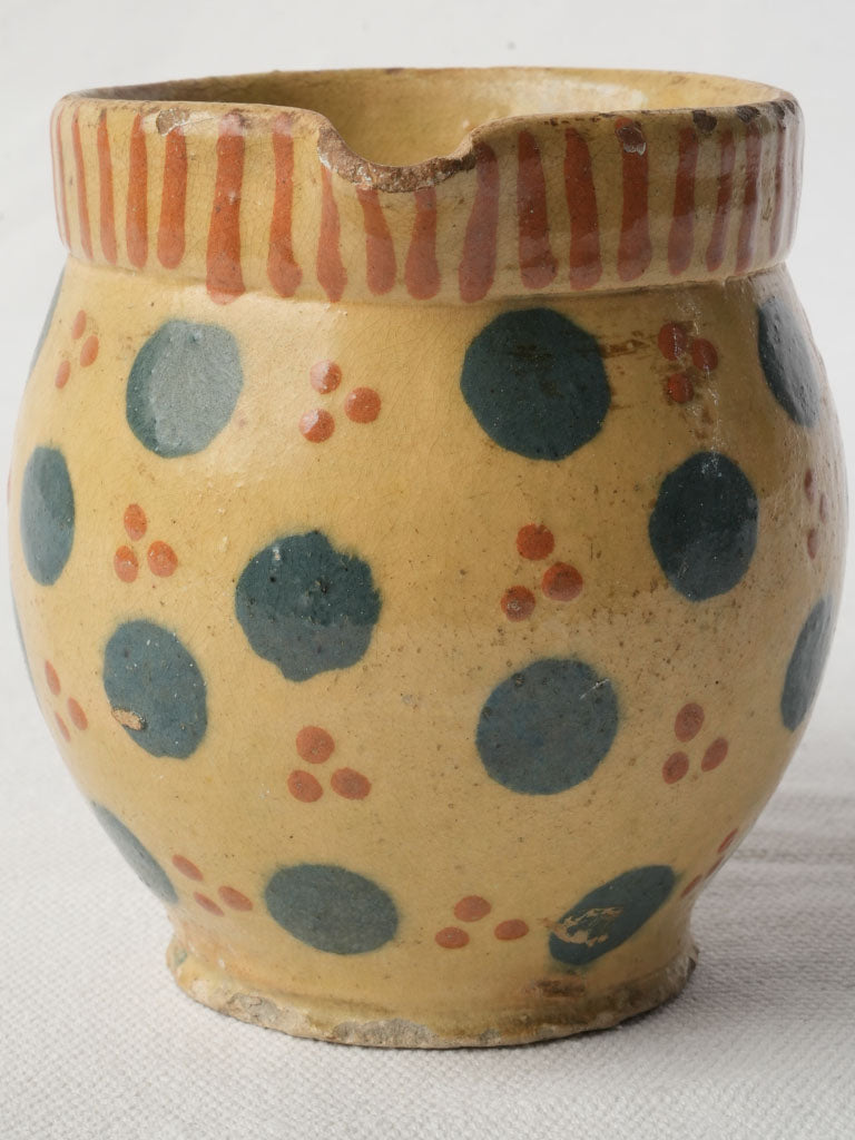Earthenware creamer with teal dots