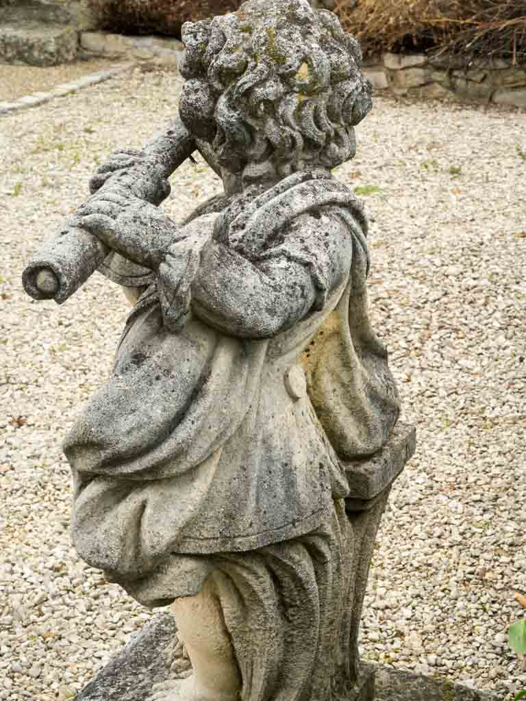 Delicate aged cherub garden decor