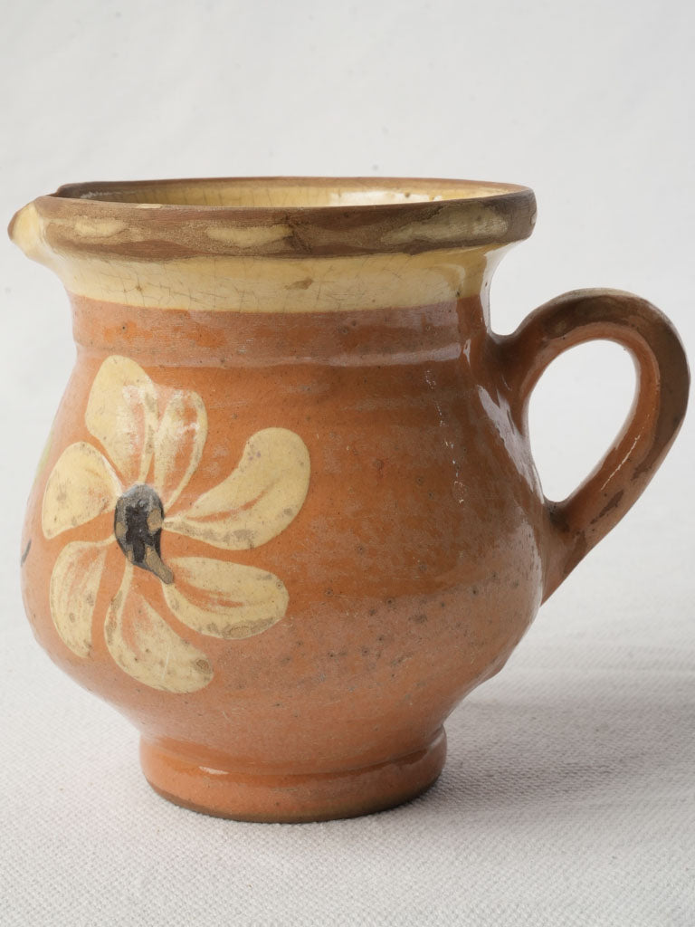 Cream-rimmed glazed vintage milk jug