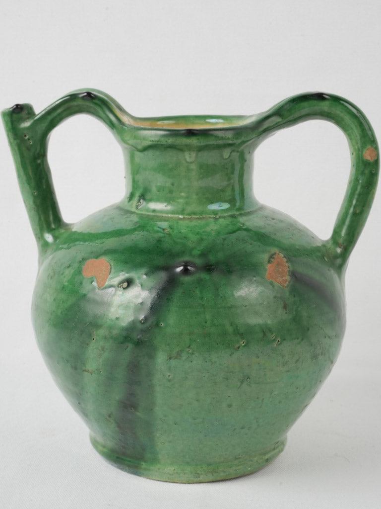 Age-worn, dual-handled water pot