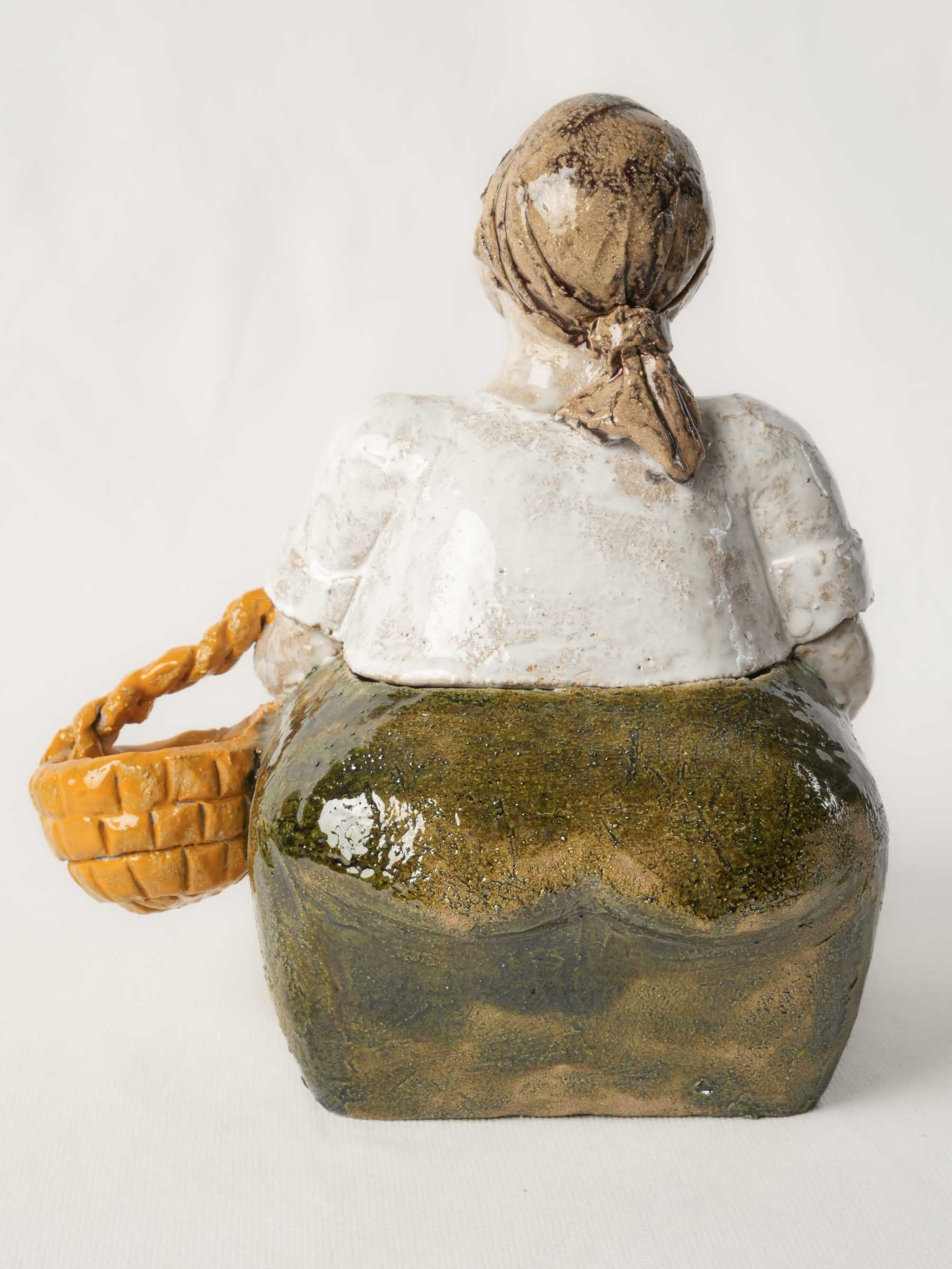 Boldly sculpted market woman jar.