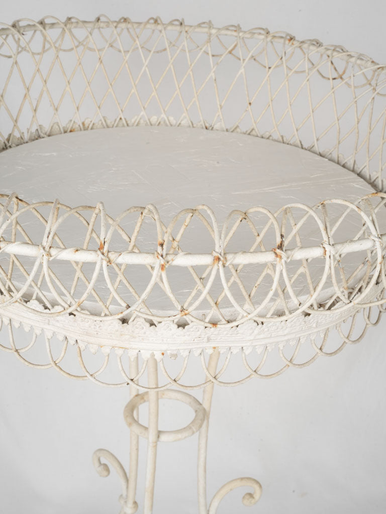 Graceful scrolling feet plant stand