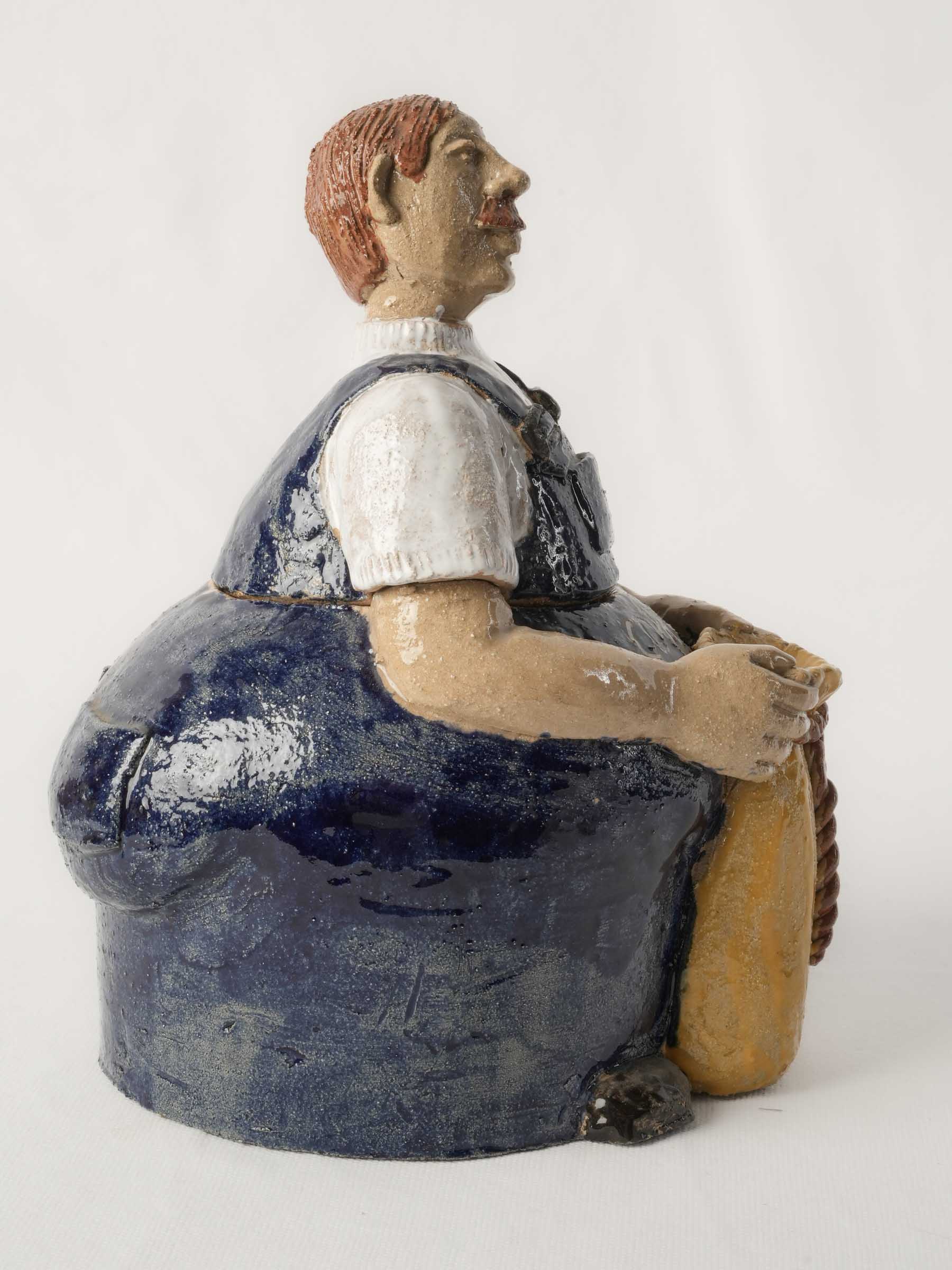 Humorous moustached ceramic vessel