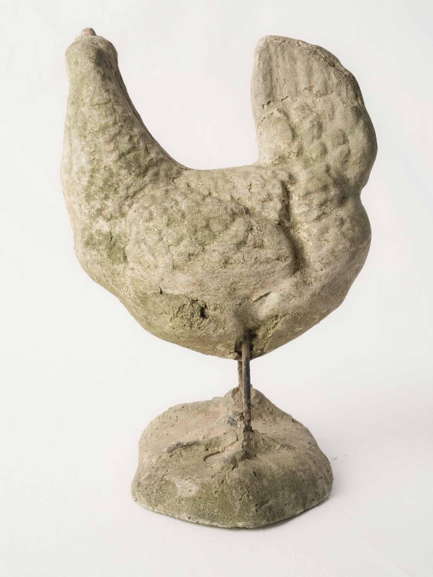Aged stone-grey hen statue