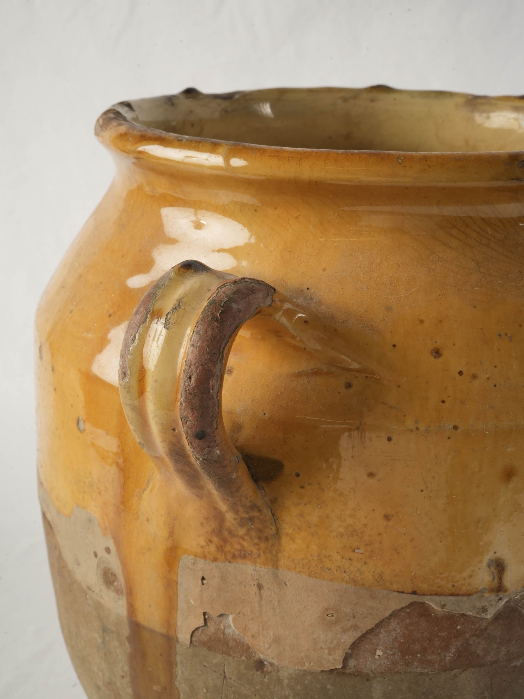 Authentic handmade mustard-yellow confit pot