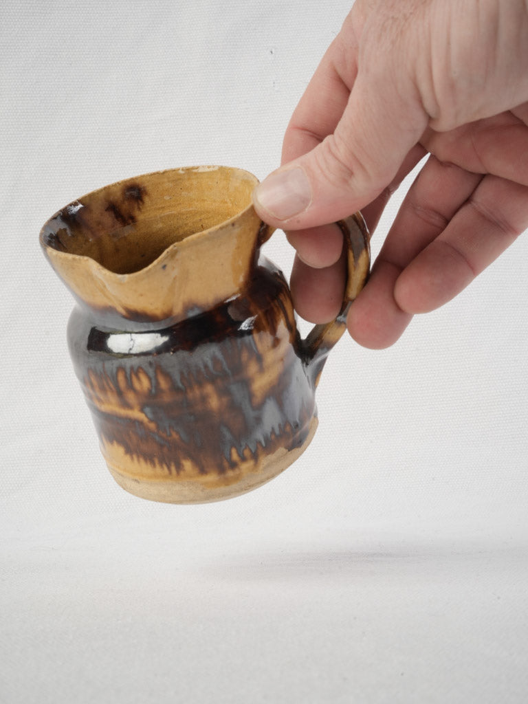 Iridescent drip-glazed pottery pitcher