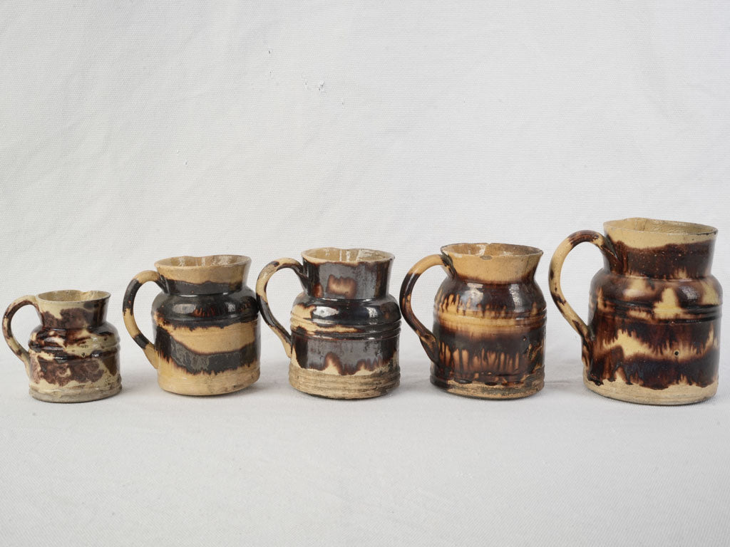 Graduated Set Of Five Early 20th Century Dieulefit Ceramic Pitchers