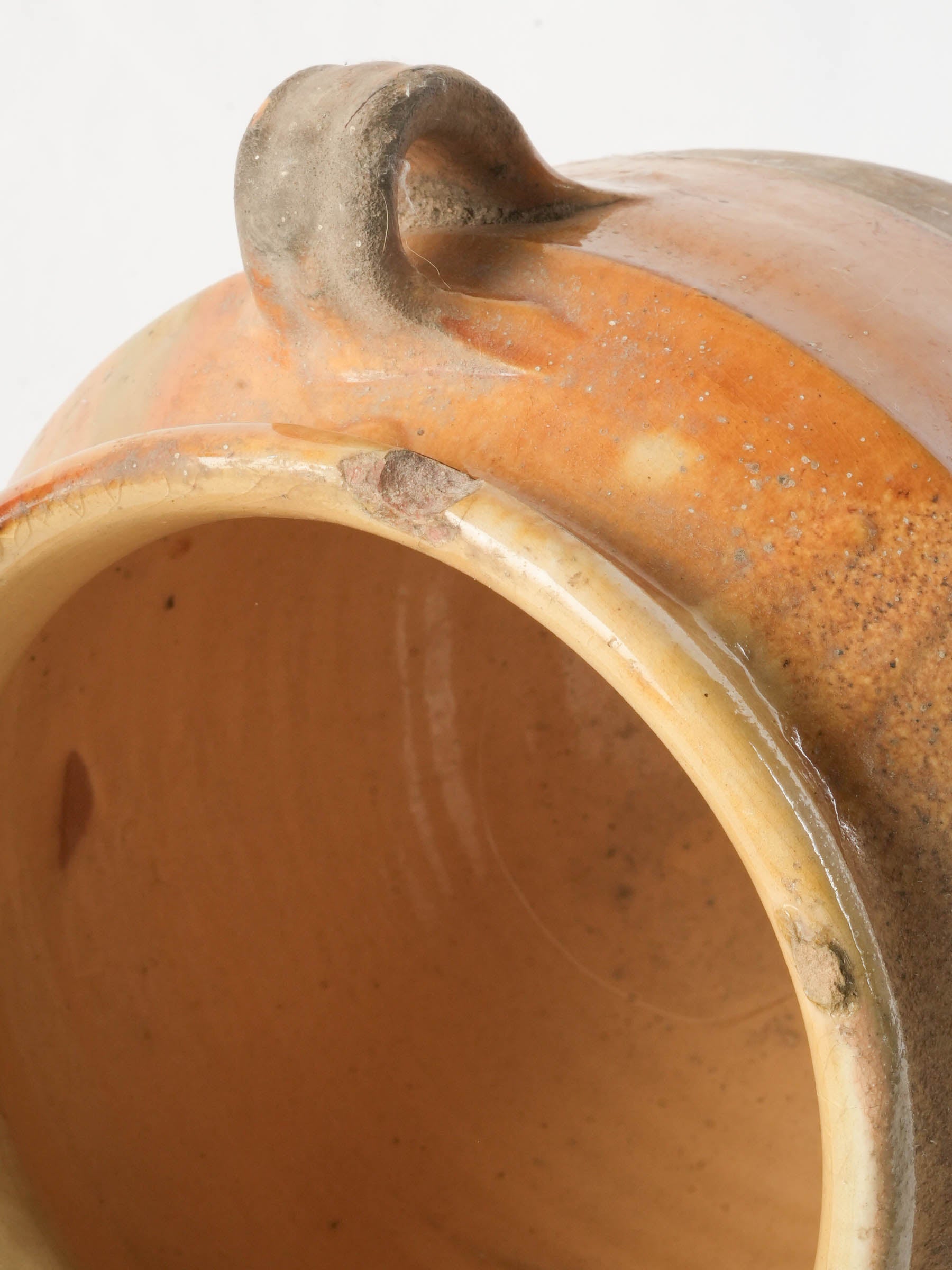 Timeworn mineralized handled pottery