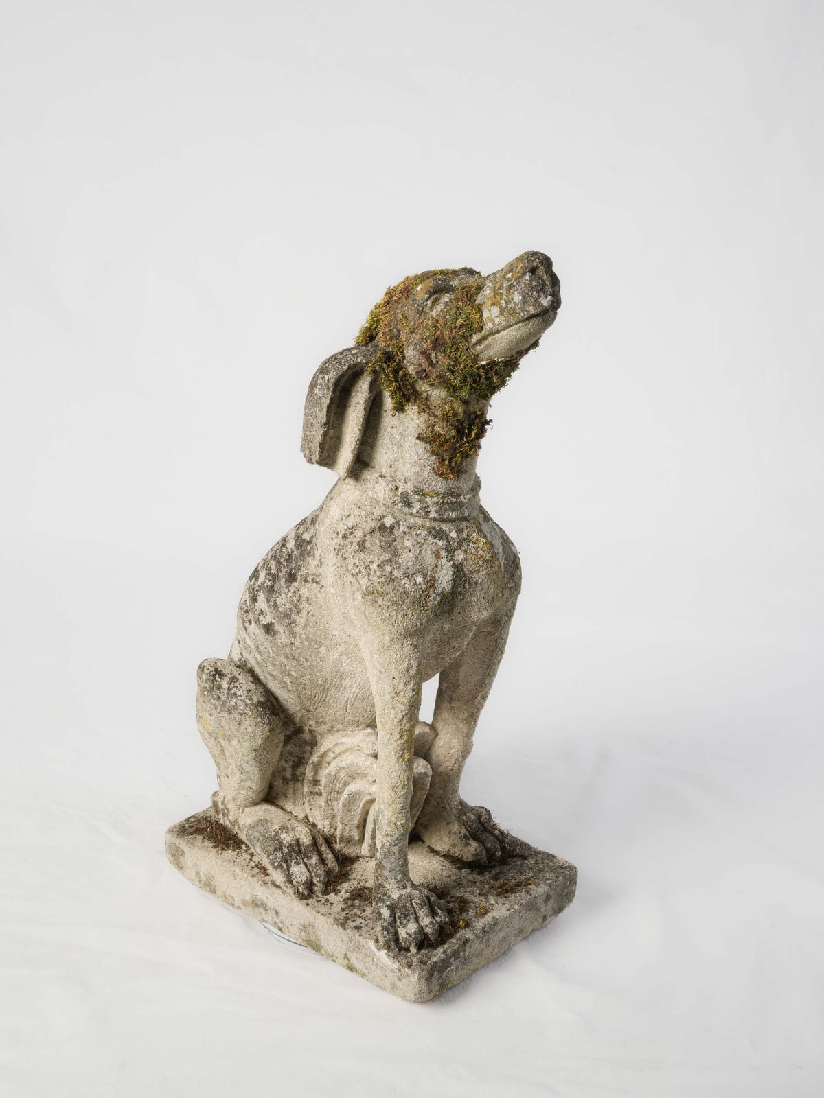 Moss-covered French estate sculpture