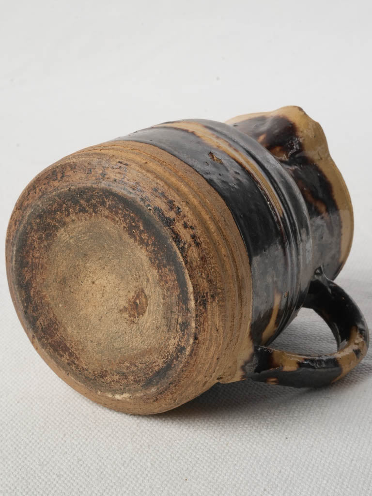 Timeworn earthenware pouring jug