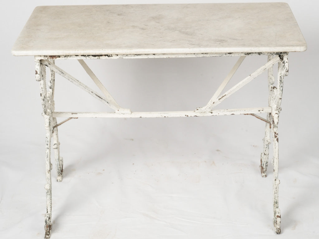 Elegant aged outdoor dining bistro table