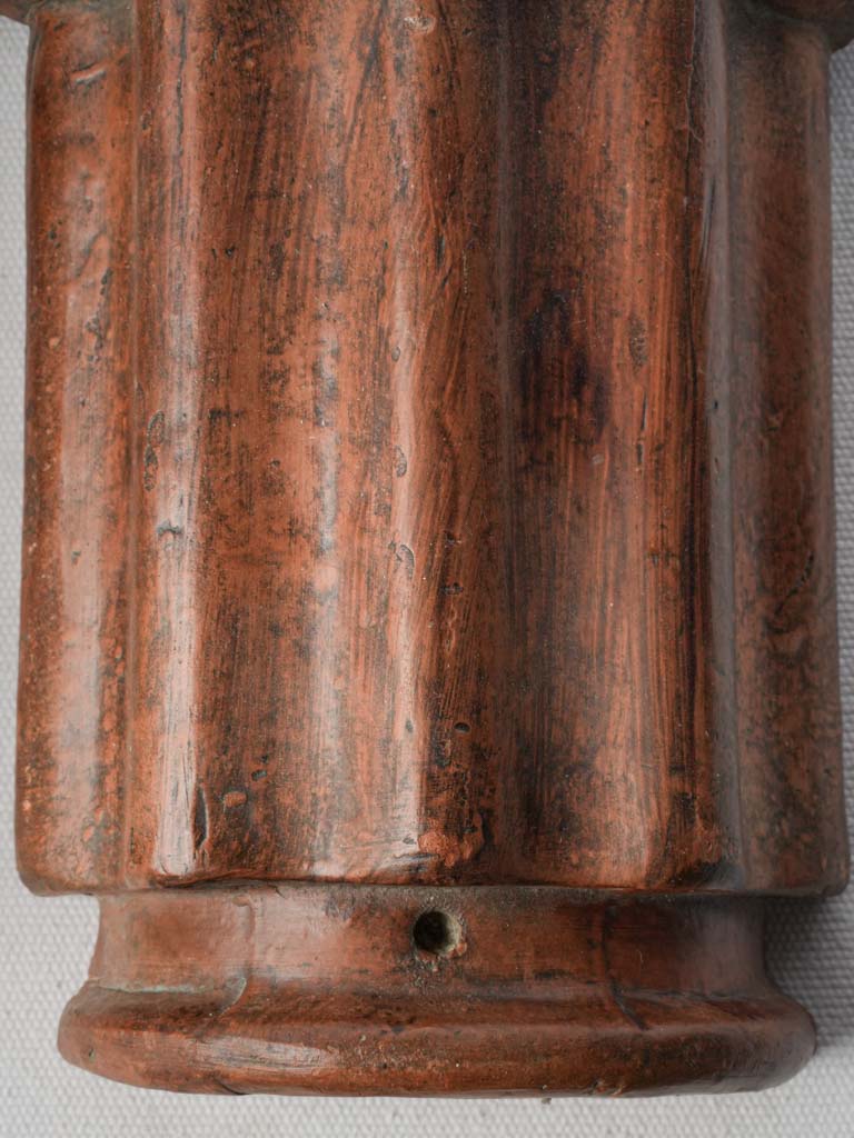 Warm patinated terracotta elements