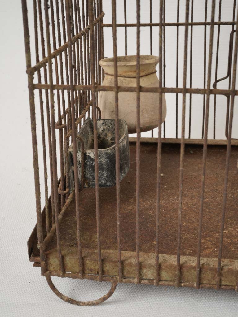 Timeworn feeding tray birdcage