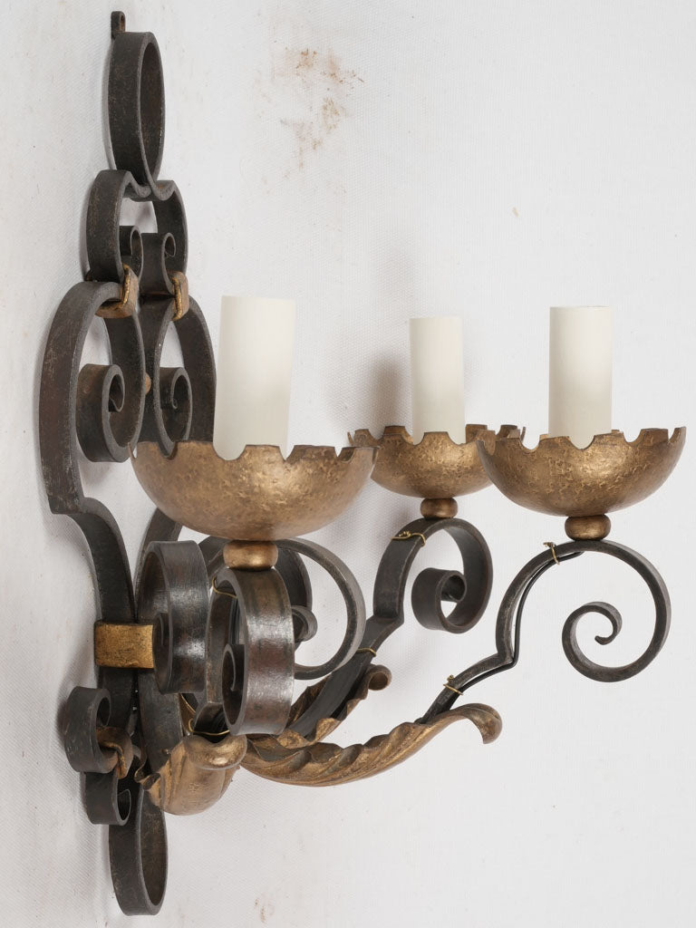 Sculptural 1940s iron wall lamps