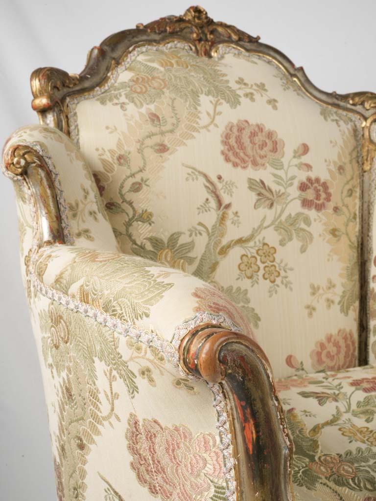 Ornate floral-patterned bergère armchair