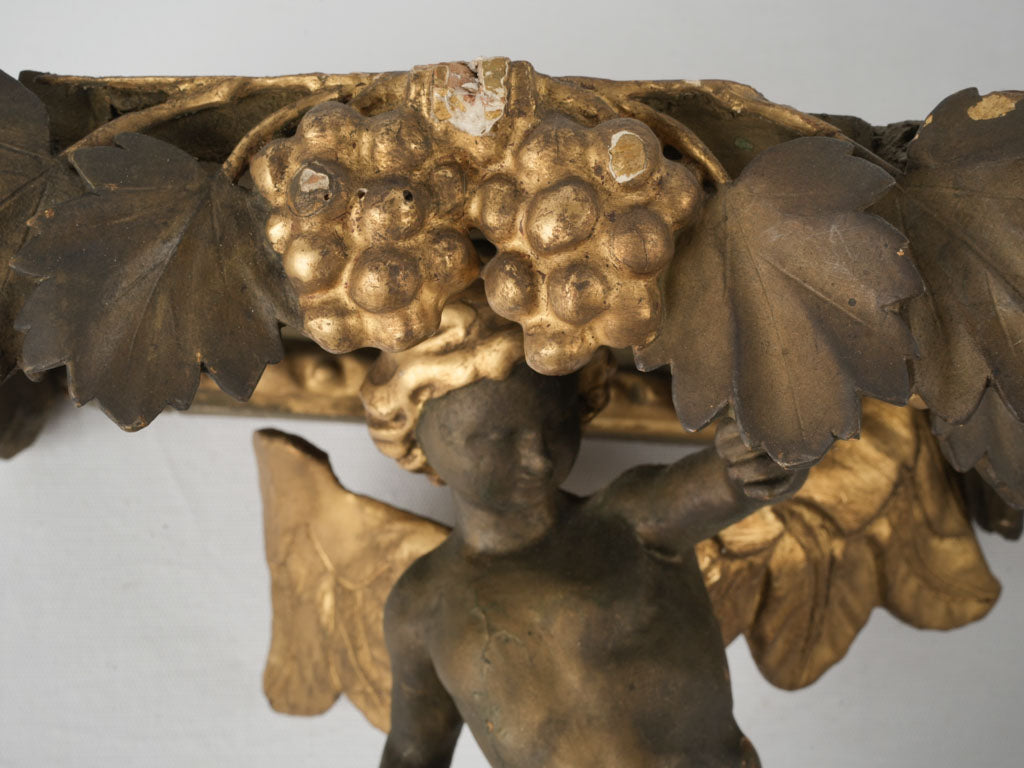 Aged wood cherub wall ornament
