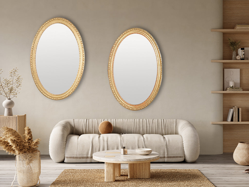 Baroque-inspired French gilded oval mirrors