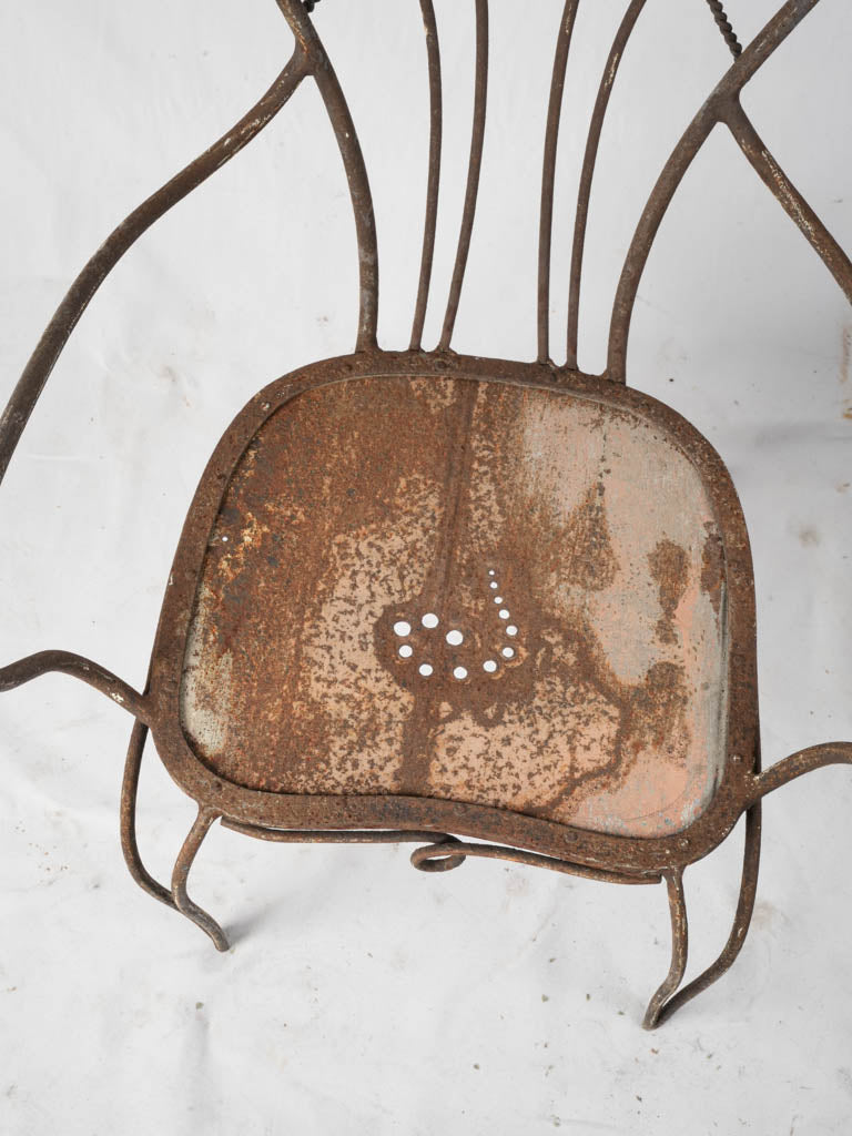 Aged iron poetic garden armchairs