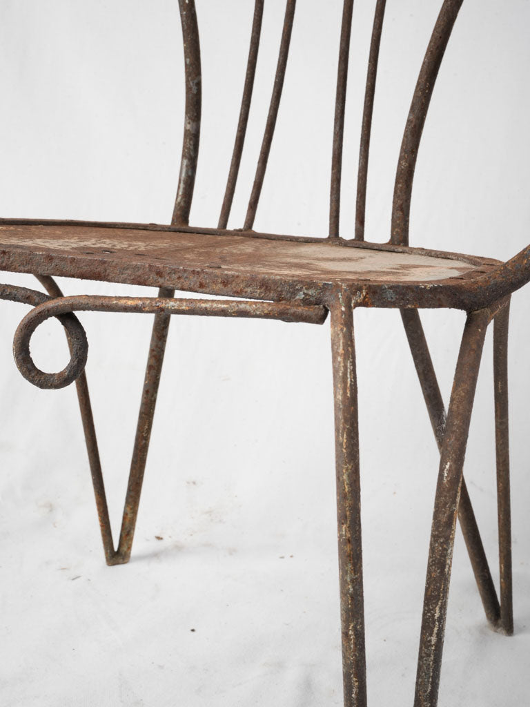 Weathered finish wrought iron chairs