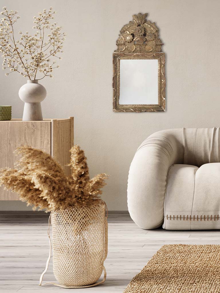 Rustic gilt ornamental wood-framed mirror