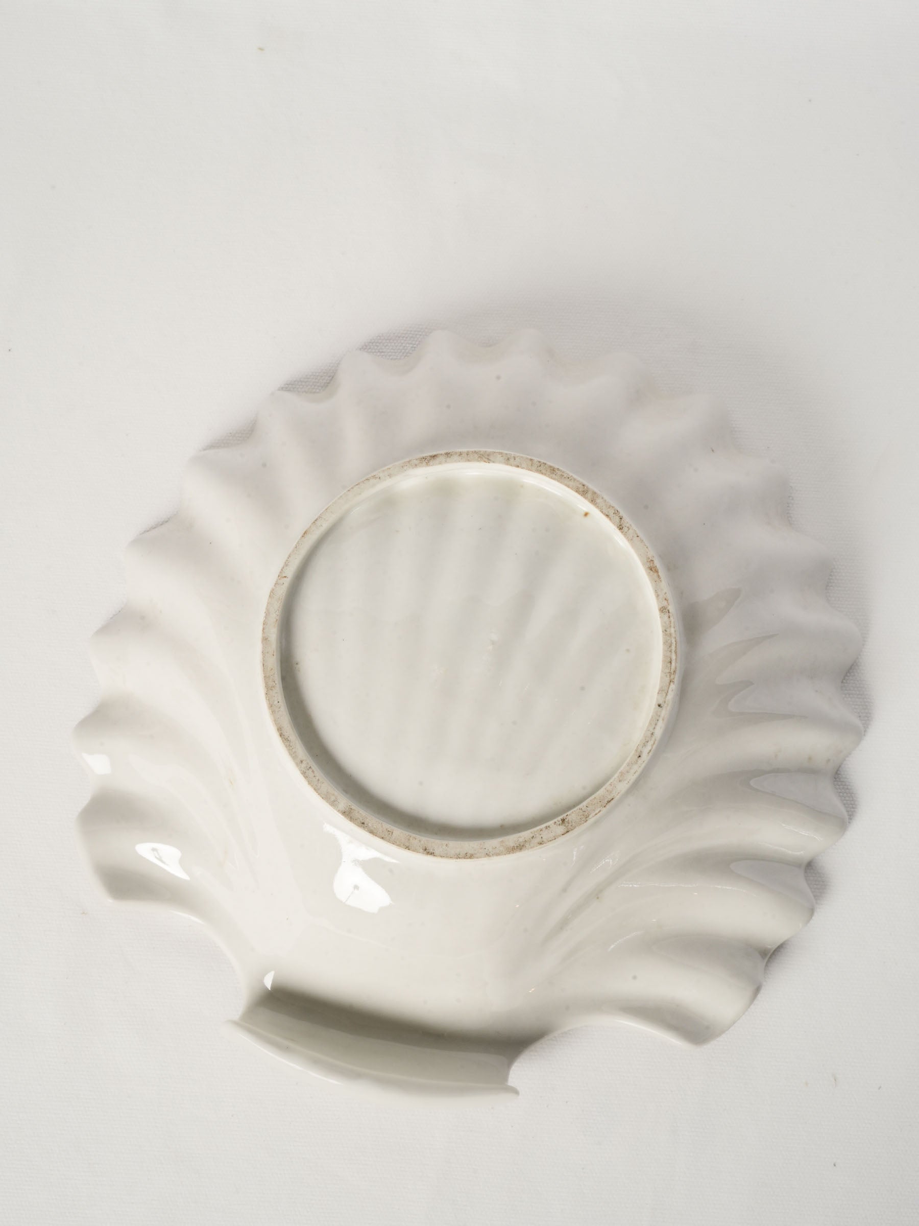 Luminous ivory-white glazed faience dish