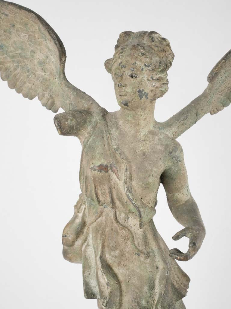 Historical brass-winged sculpture, missing arm
