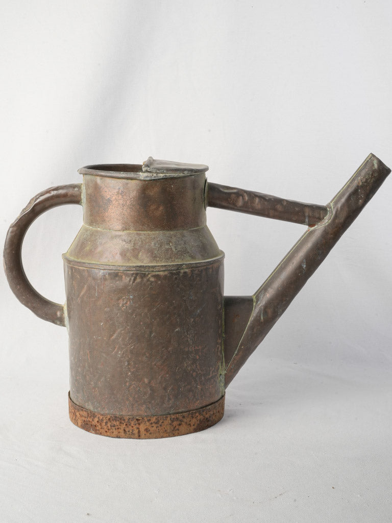 Aged artisanal vineyard sprinkling can