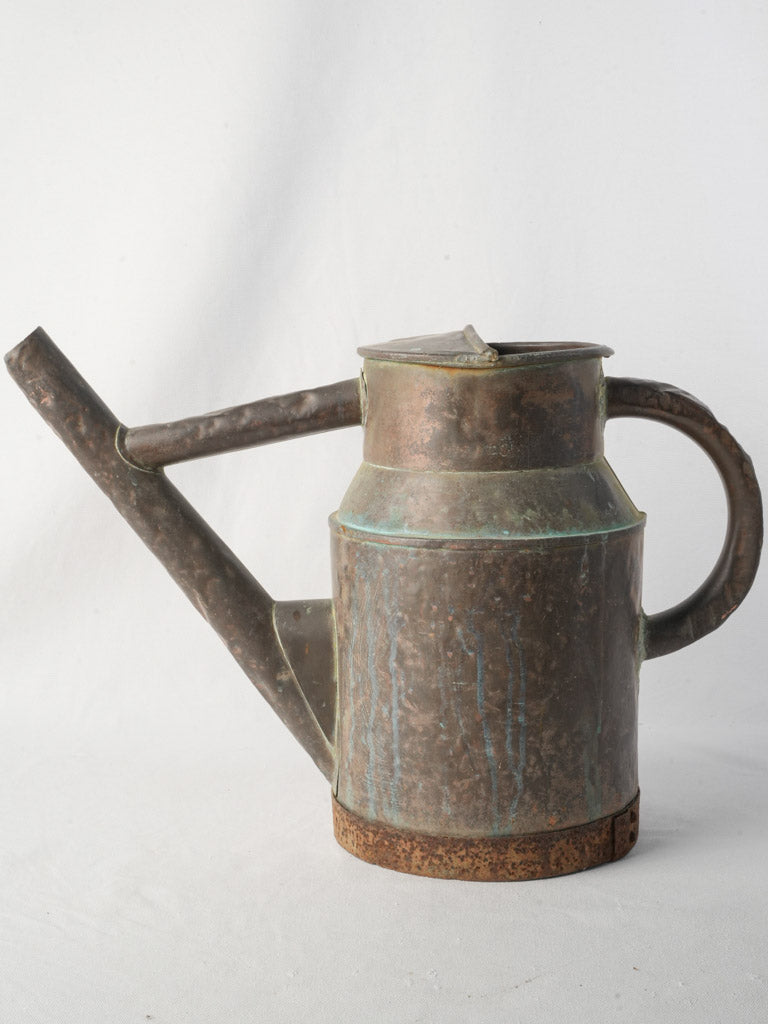 Streaked verdigris antique watering can