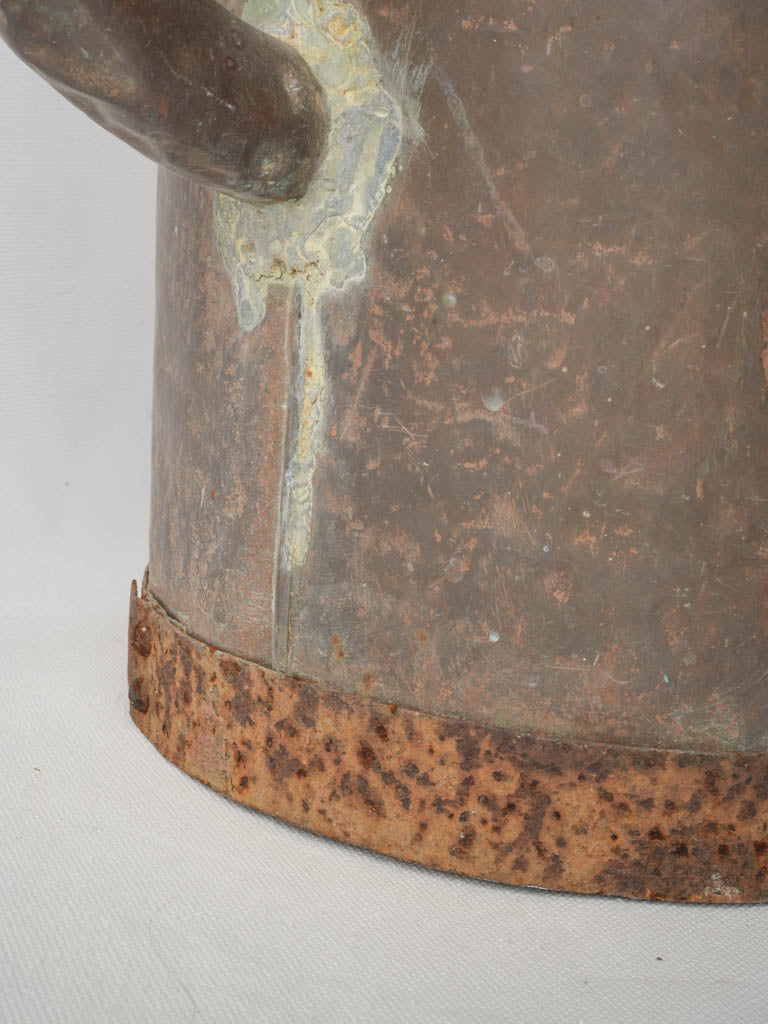 Rustic timeworn vineyard water can