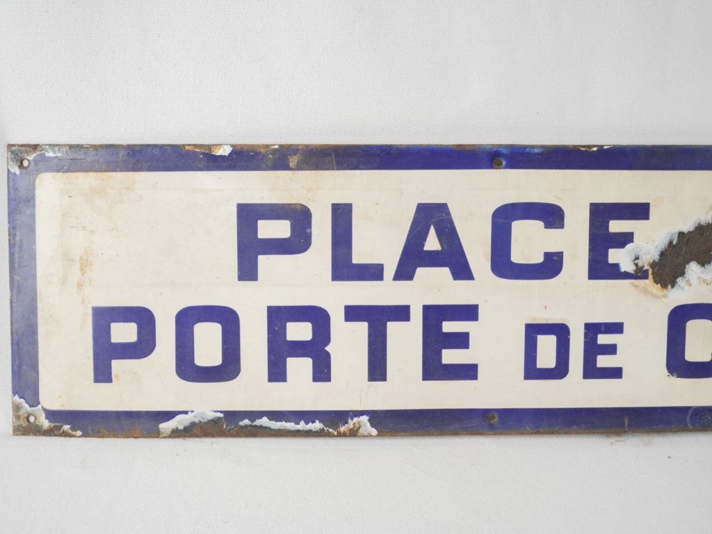 Blue and white sheet metal sign