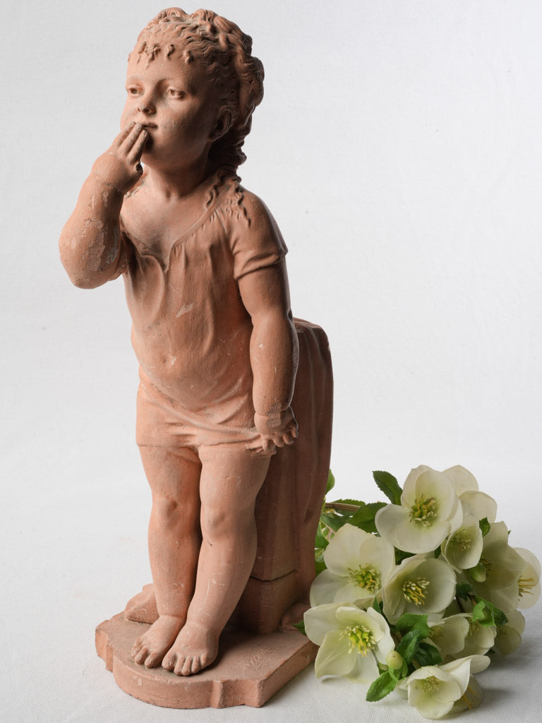 Delicate classical-style girl sculpture.