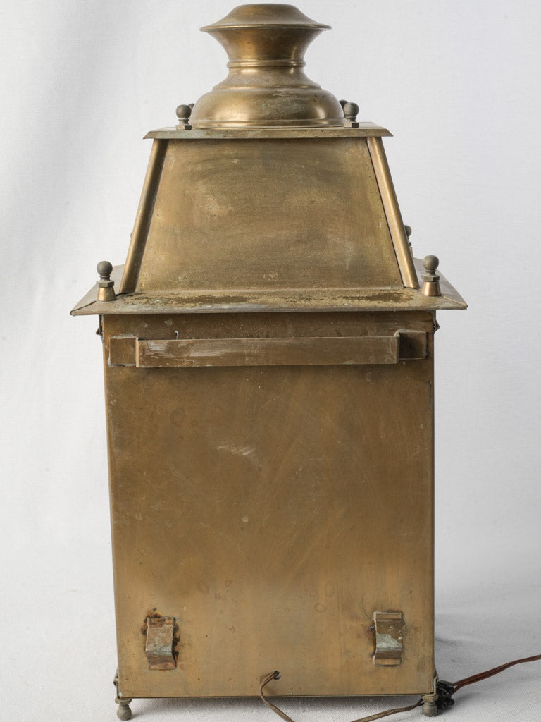 Decorative restrained brass lantern