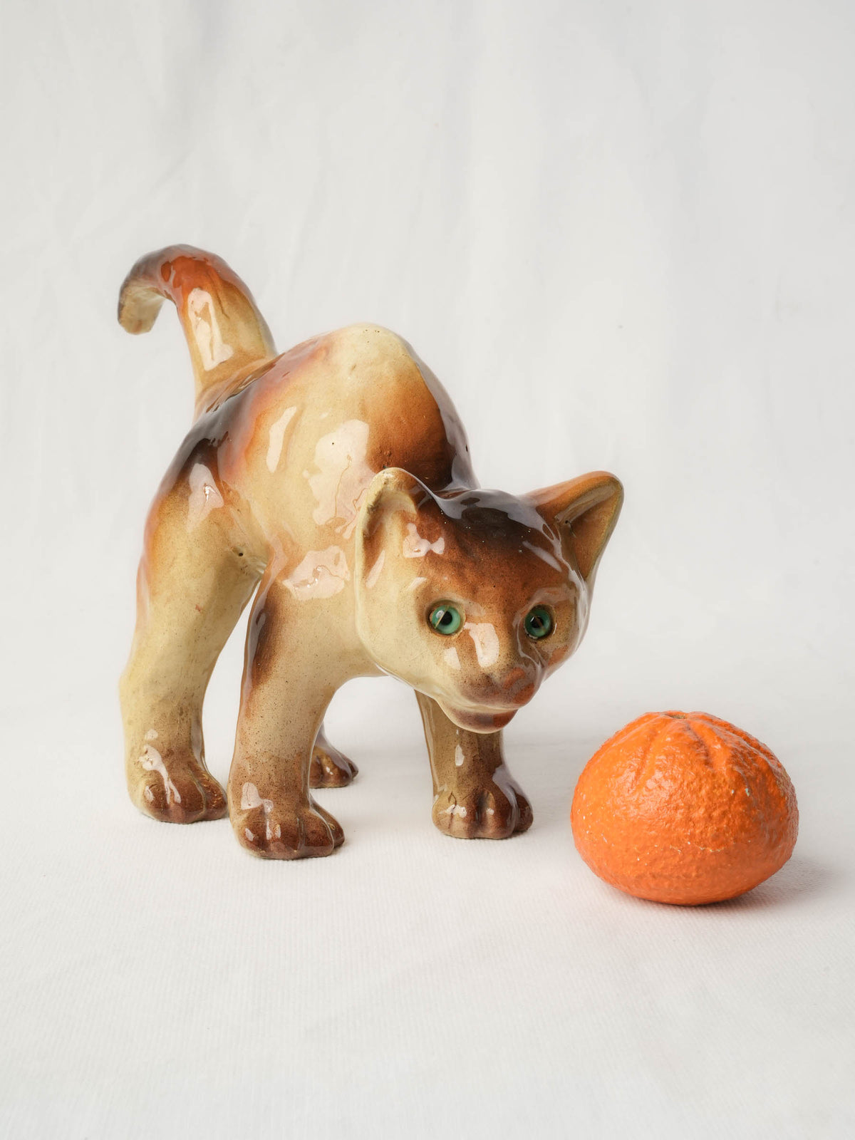 Playful Glazed Ceramic “Scaredy-Cat” Kitten, c. 1920 - 8" x 10¼"