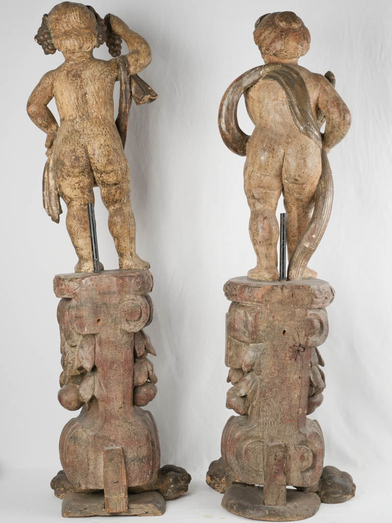 Antique, floor lamp-style cherub carvings