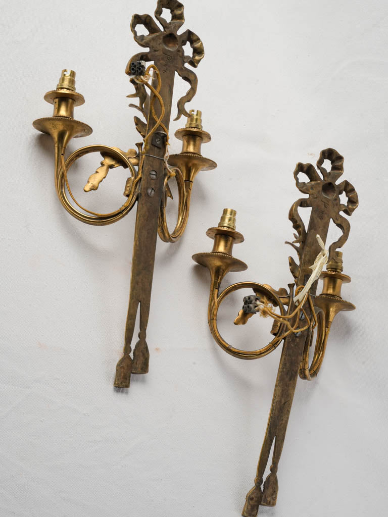 Symmetrical ornate candle sconces