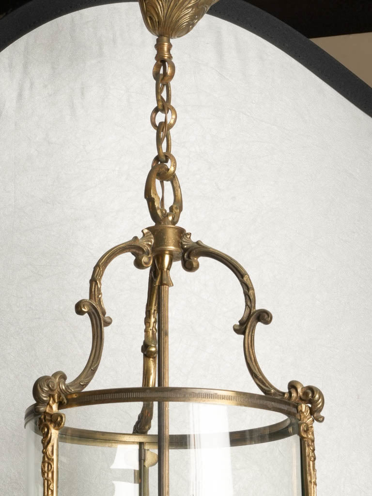 Sophisticated gilded glass panel lantern