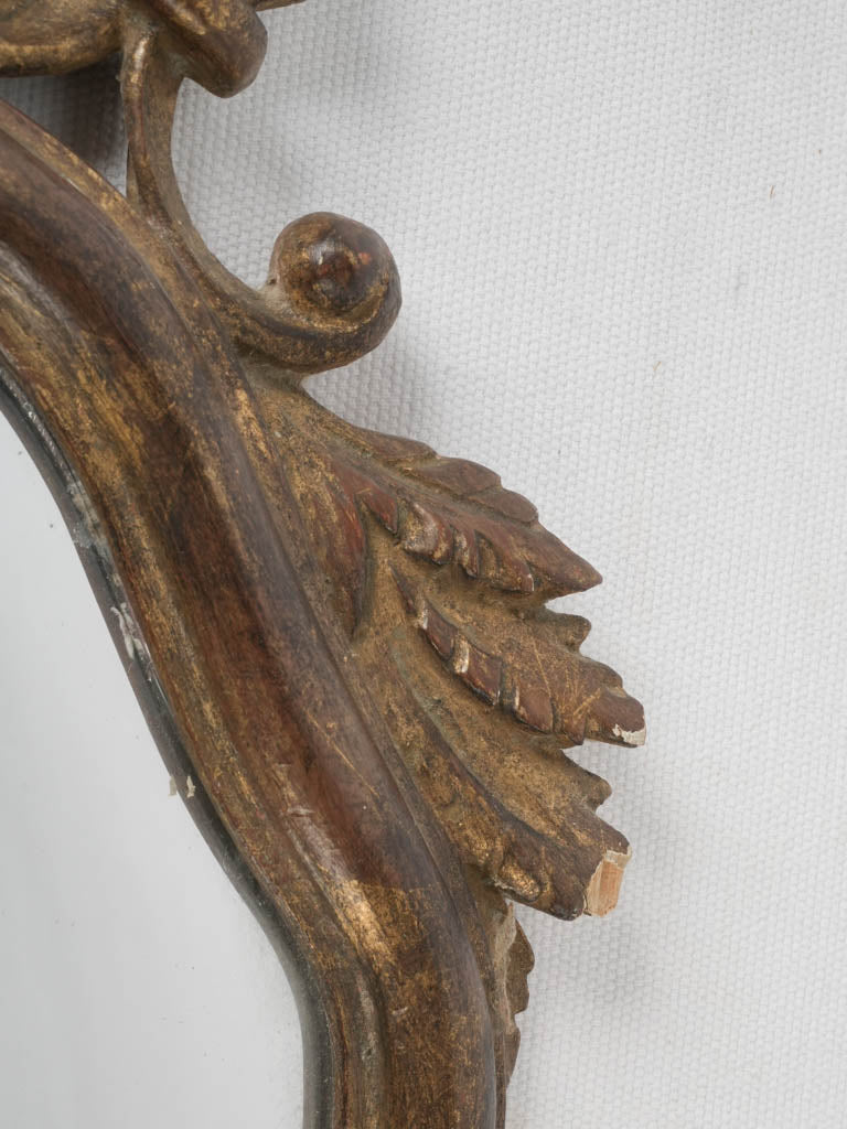 Vintage mirror with scrolling acanthus leaves