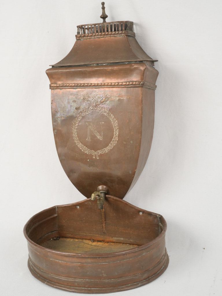Aged copper wall-mounted fountain