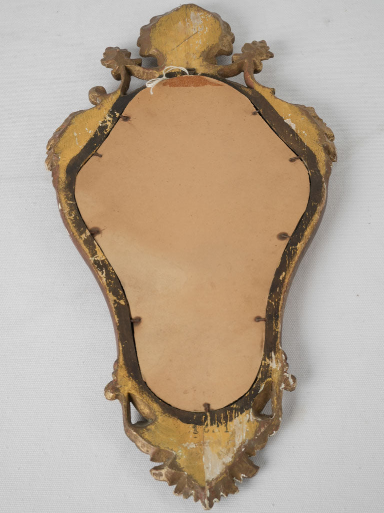 Pretty sculptural vintage mirror for powder room