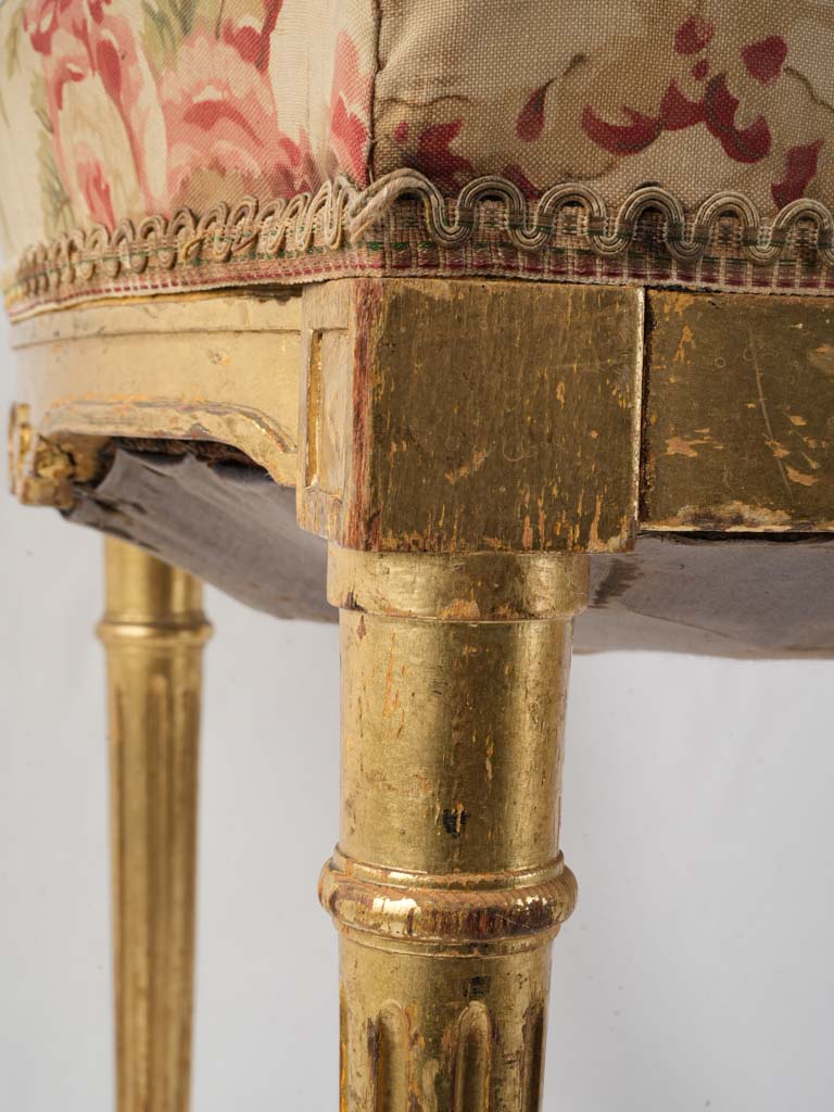 Worn antique upholstered chair