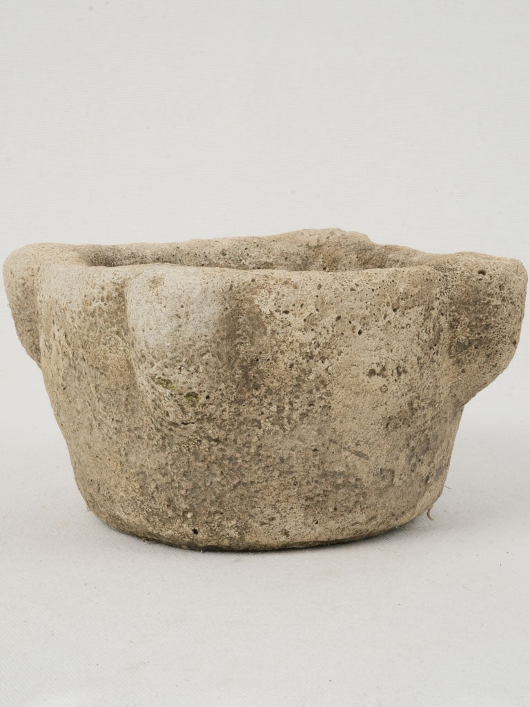 Sturdy, weathered stone grinding mortar