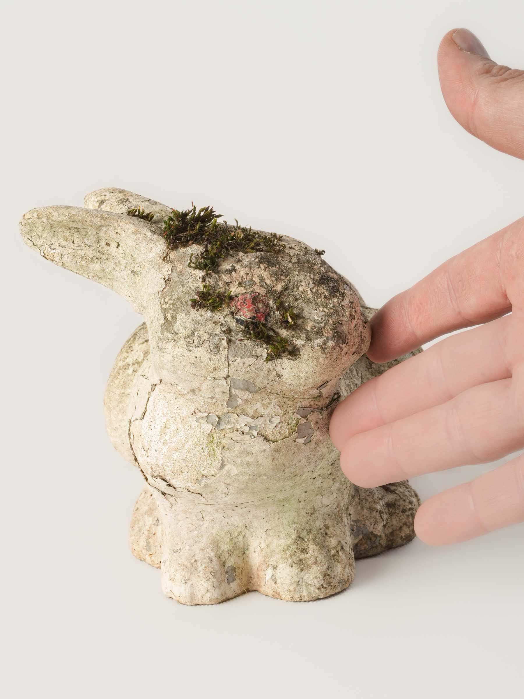 Weathered rustic ceramic rabbit statue