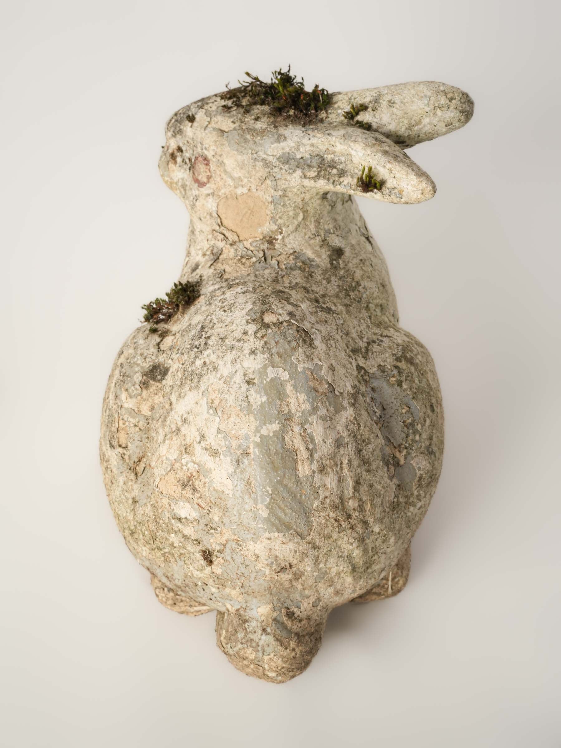 Textured moss-covered rabbit sculpture