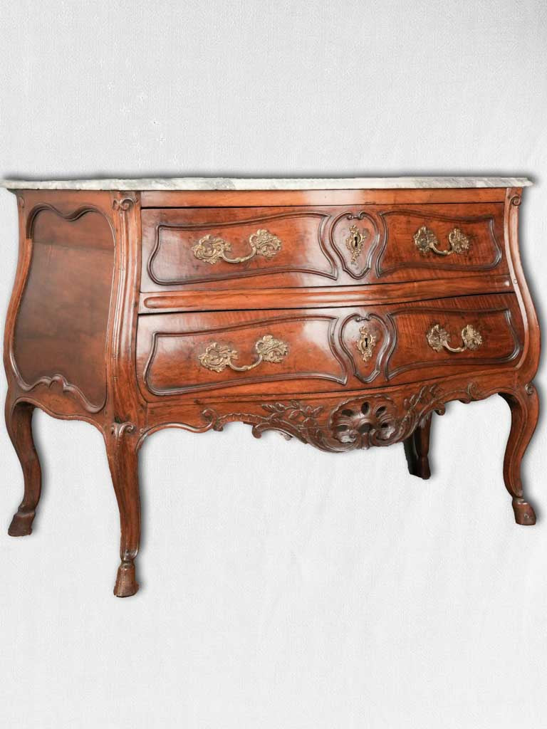 Ornate marble-topped Regence commode