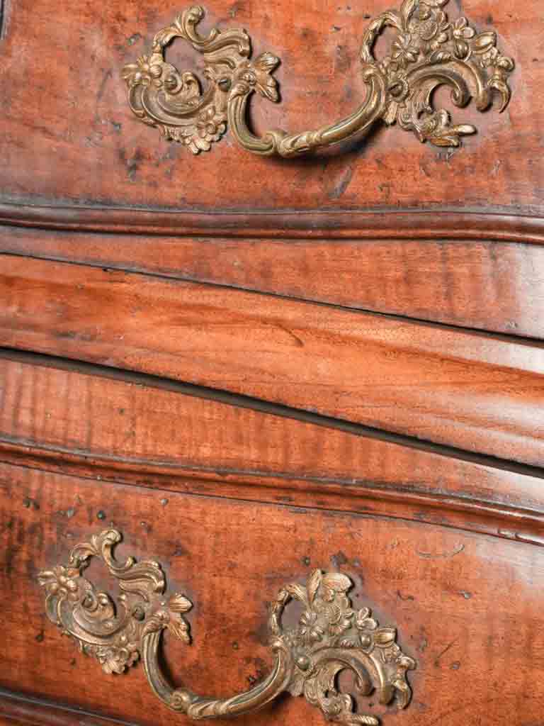 Intricate scallop shell commode embellishment
