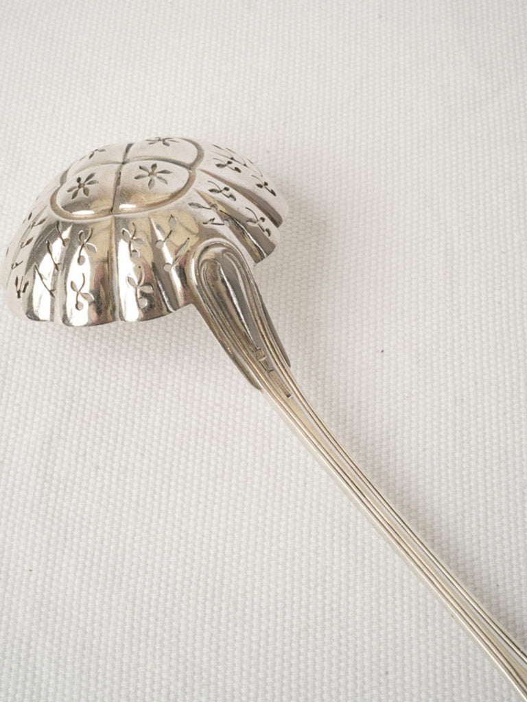 Ornate silver-plated sifter