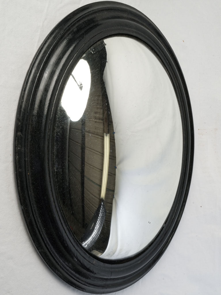 Late 19th Century French Oval Convex Witch's Mirror w/ Black Lacquered Frame- 22¾" x 17¾"