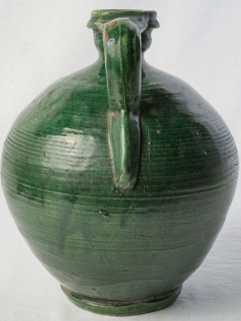 Glossy glazed antique water jug