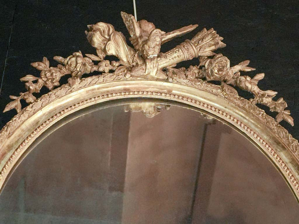 Intricately carved giltwood marriage mirror