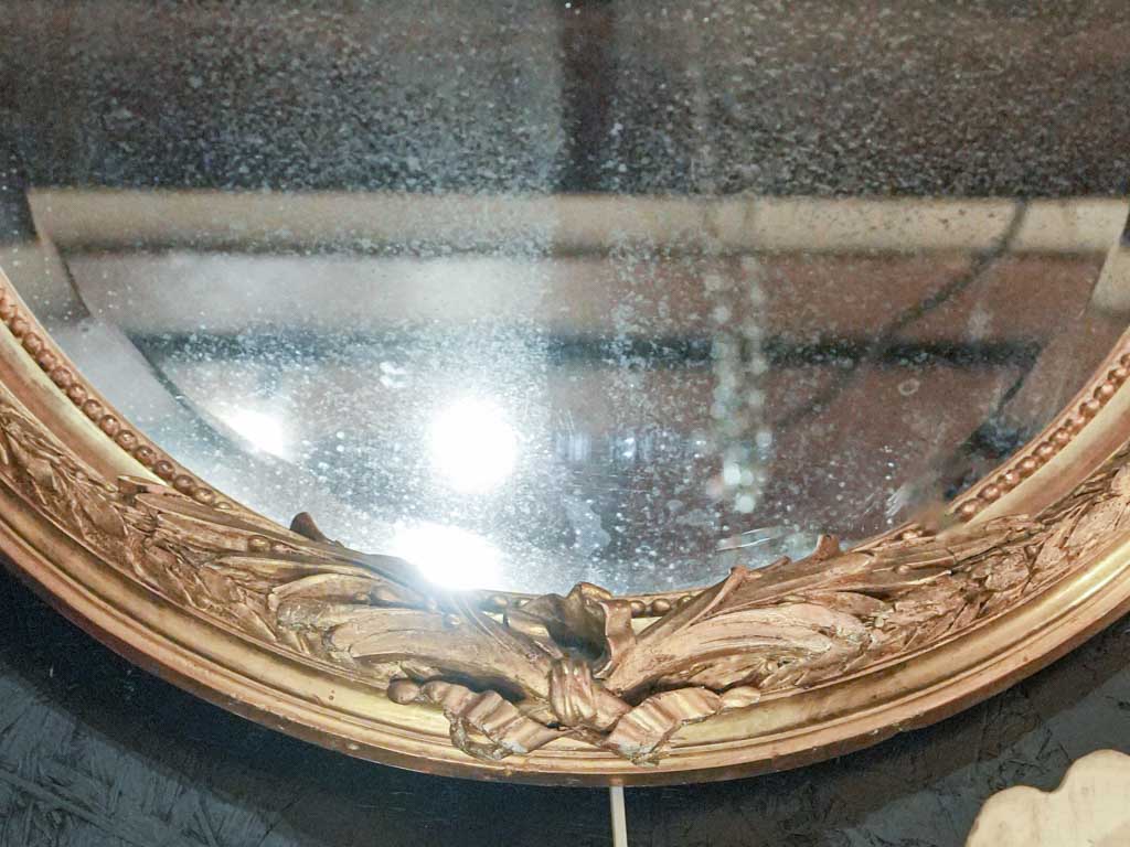 Refined symmetrical floral motif mirror